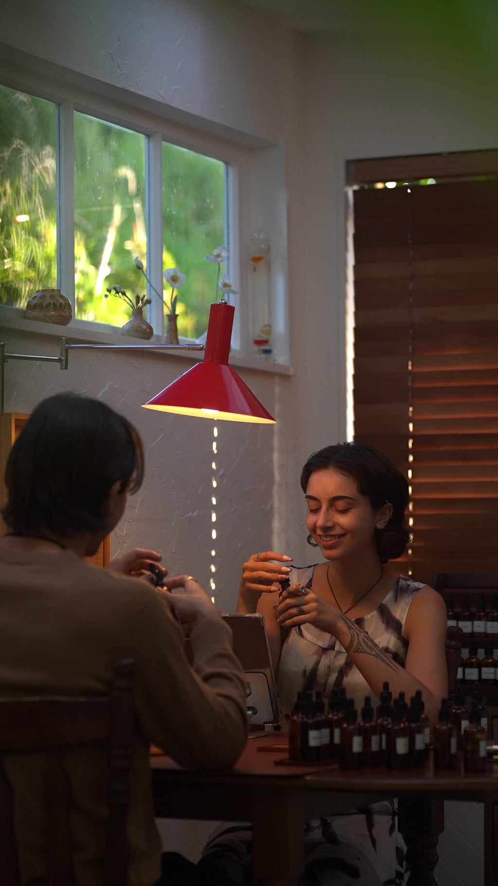 Two guests blending fragrance oils during a private perfume workshop at Sok Studios in Auckland.